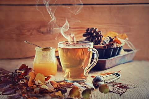 steaming hot tea with honey - adaptogen drinks